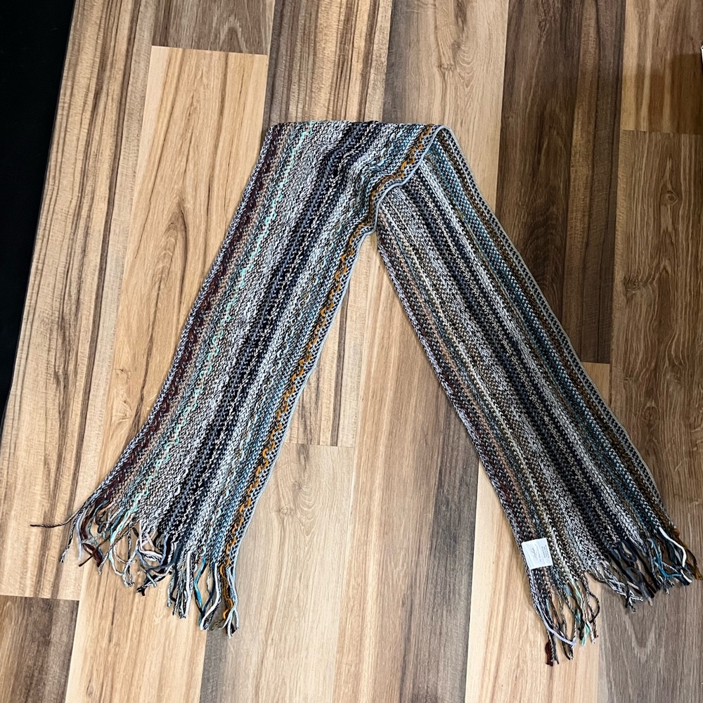 Multi-colored lightweight knit scarf.